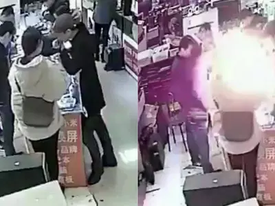 chinese man bites into smartphone battery which explodes