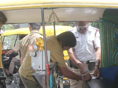 Auto Driver Fined For Not Wearing Helmet
