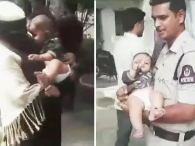 Police Officers Babysit Infant As Mother Completes Exam