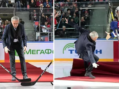 jose mourinho slips at an ice hockey