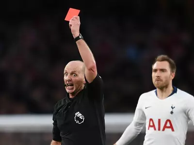 Mike Dean is on 99 red cards