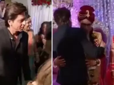 Shah Rukh Khan attend's make-up man's wedding, hugs the bride and the groom.