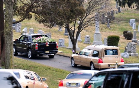 A hearse carrying Whitney Houston's body arrives 