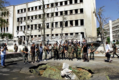 Explosions strike Syrian army building