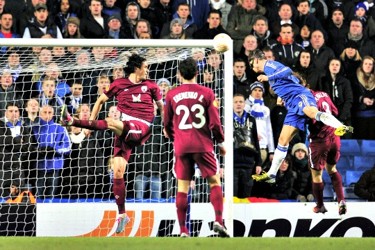 Chelsea's Spanish striker Fernando Torres scores the third goal during the UEFA Europa League quarter-final first leg football match against Rubin Kazan at Stamford Bridge in London