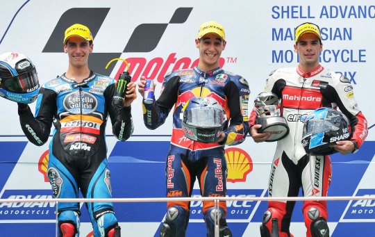 Red Bull KTM Ajo's Spanish rider Luis Salom (C), second-placed Estrella Galicia's Spanish rider Alex Rins (L) and third-placed Mahindra Racing Portugal rider Miguel Oliviera 