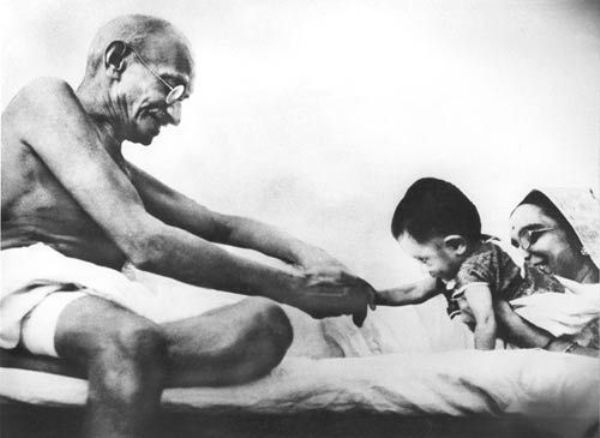 Gandhi playing with a kid