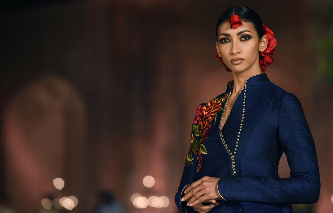 Models present creations by Indian designer Rohit Bal during the Grand Final of the Wills Lifestyle Indian Fashion Week Spring