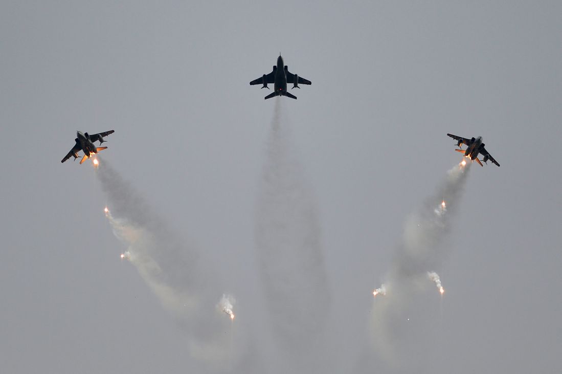 IAF Jaguar jets release flares during an air display 