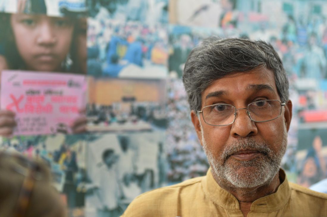 Kailash Satyarthi gestures at his home office