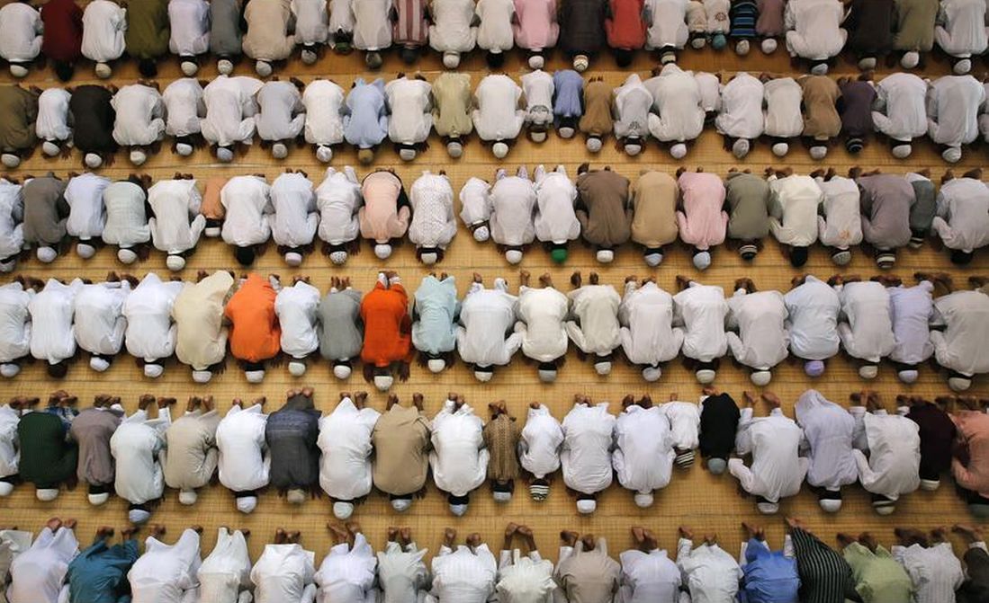 Muslims offer prayers during Eid al-Adha