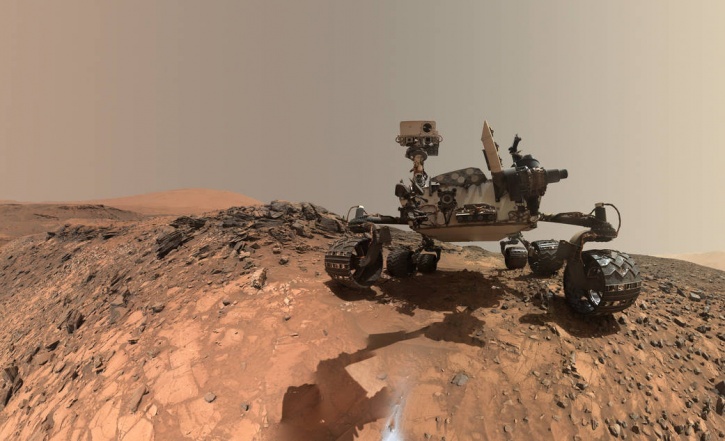 A low-angle self portrait was taken by NASA's Curiosity Mars rover before it started drilling into a target rock known as 'The Buckskin' on lower Mount Sharp. This particular selfie is special for two reasons; one, it is from a place where no self-obsessed selfie star has ever been, Mars. Two, it's more than just a duck face. The selfie combines several component images taken by Curiosity's Mars Hand Lens Imager (MAHLI) on Aug. 5, 2015, during the 1,065th Martian day, or sol, of the rover's work on Mars. For scale, the rover's wheels are 20 inches (50 centimeters) in diameter and about 16 inches (40 centimeters) wide.  <Image1> The selfie does not include the rover's robotic arm beyond a portion of the upper arm held nearly vertical from the shoulder joint. With the wrist motions and turret rotations used in pointing the camera for the component images, the arm was positioned out of the shot in the frames or portions of frames used in this mosaic, basically like how our Saturday night selfies in hotel washrooms, just that this one is from bloody Mars! <Image2> MAHLI is mounted at the end of the rover's robotic arm. For this self-portrait, the rover team positioned the camera lower in relation to the rover body than for any previous full self-portrait of Curiosity.  <Image3> Curiosity's landed inside Mars' Gale Crater on August 2012.