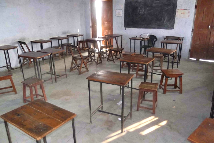 headmaster + principal date in an empty classroom