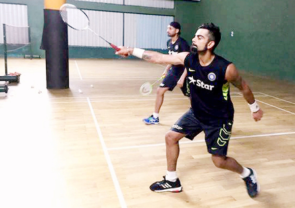 Kohli Bhajji playing badminton