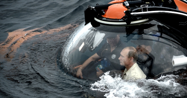 Russian President Vladimir Putin has burnished his action man image by diving down in a mini-submarine