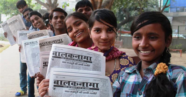 Kids holding the Balaknama newspaper