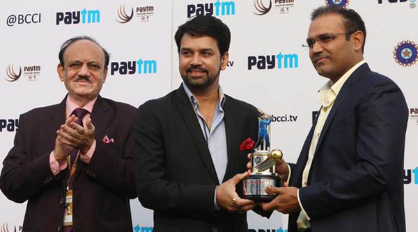 Sehwag being feted by BCCI secretary Anurag Thakur