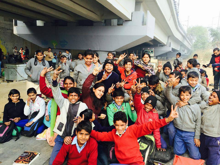 hundreds of kids study at Free school under the bridge in Delhi 