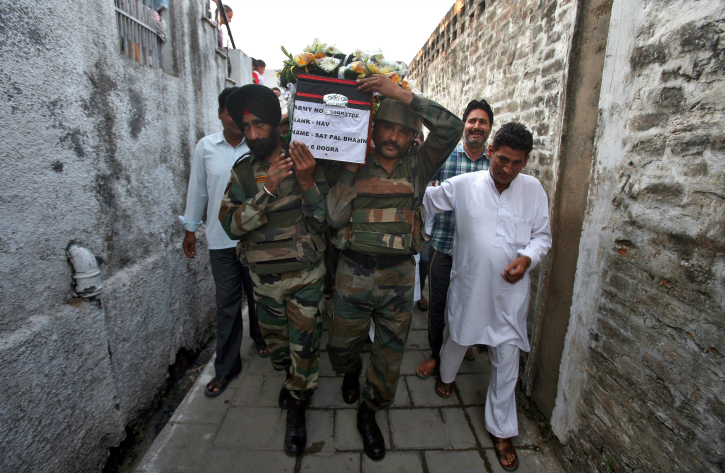 Army jawans carry collegue