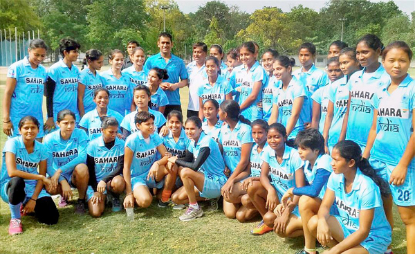 Dhoni with junior India womens hockey team members