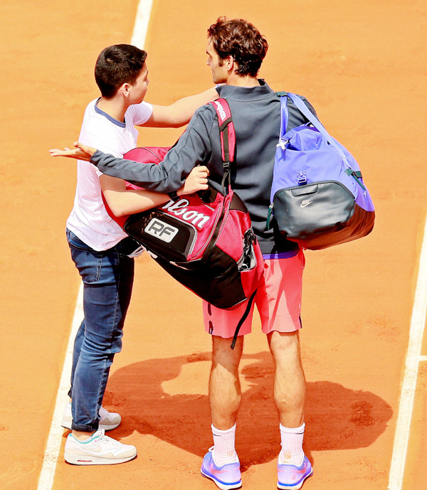 Roger Federer with a fan