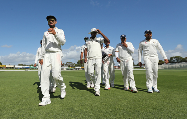 Kohli leads players out of the park