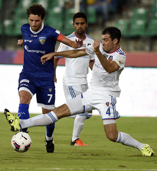 FC Goa players in action wearing white