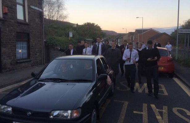 Mates who threw a mock-funeral for their friend