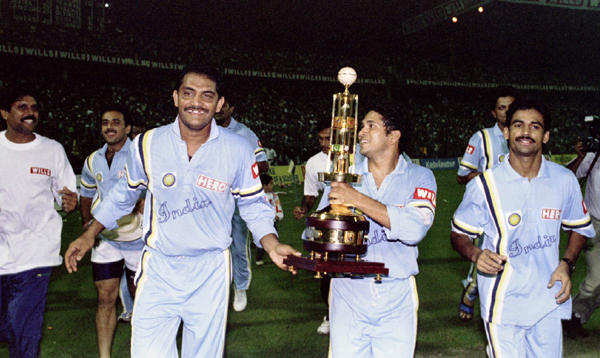 Sachin holding the hero cup trophy. Kapil is seen on left corner