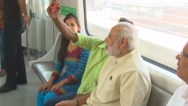 Passenger takes selfie with Modi on Delhi Metro