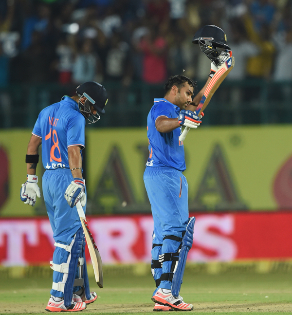 Rohit celebrates after reaching his hundred