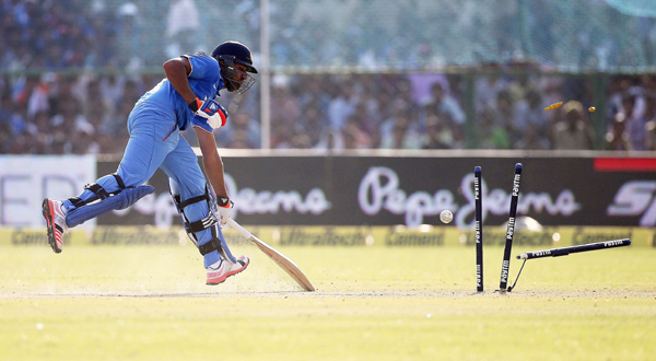 Rohit scampers through to the non-striker
