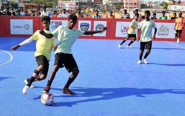 boys playing the slumsoccer tournament