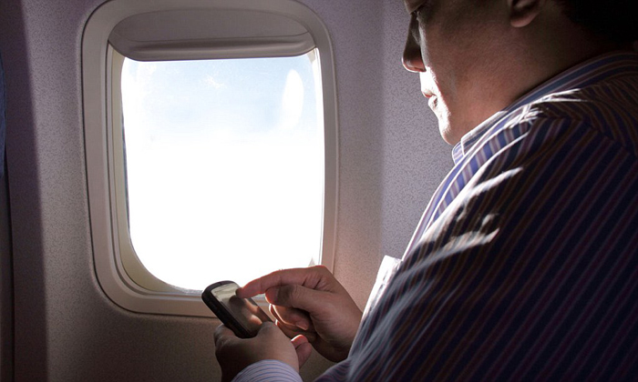 Active mobile phones in airplanes will interfere with the navigation and communications systems -– is deemed hazardous for safety and hence banned