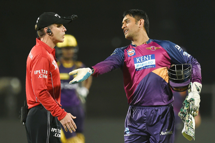 Dhoni with umpire