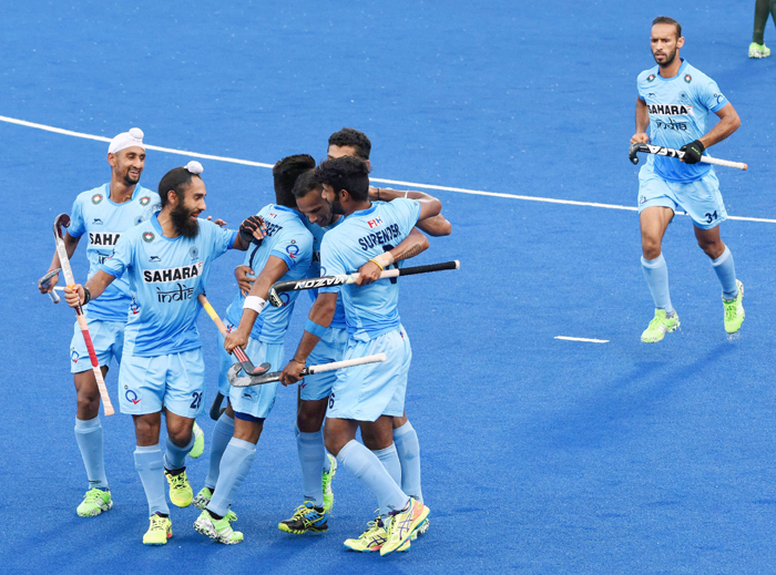 Indian hockey team celebrates a goal