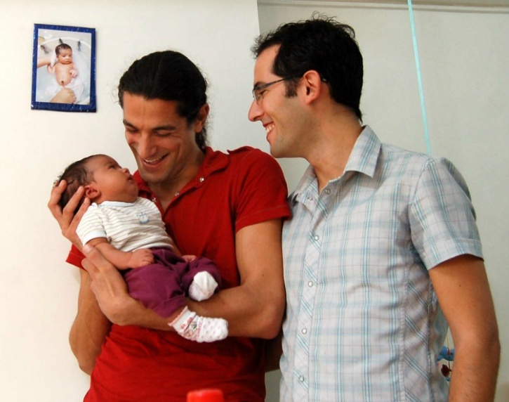 Israeli couple with their surrogate child