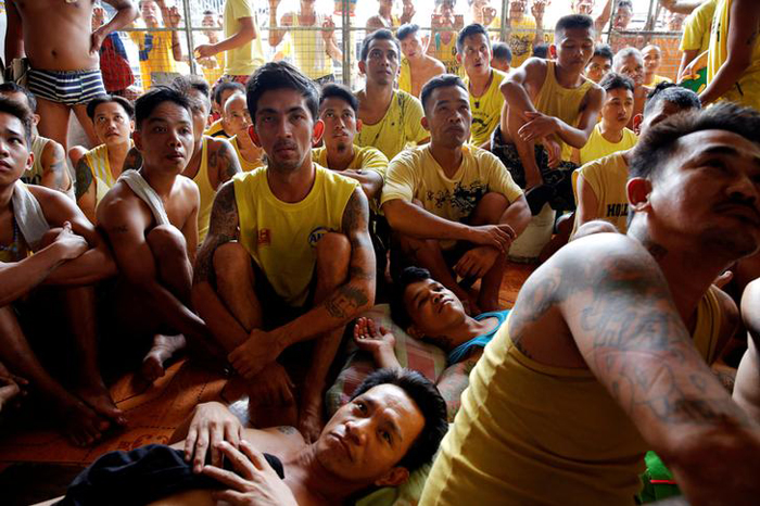 Inmates watch a movie at Quezon City Jail in Manila