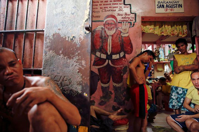Inmates pass the time at Quezon City Jail in Manila, Philippines
