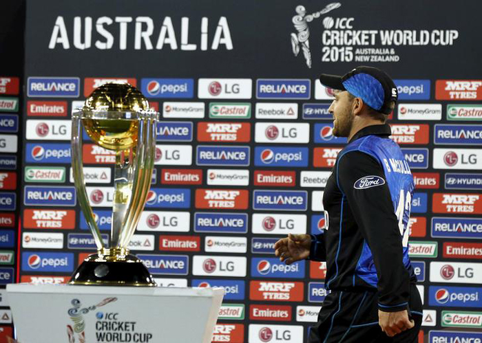 McCullum walks past the World Cup trophy