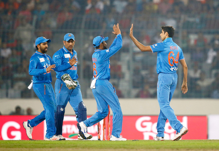 Nehra celebrates with the team