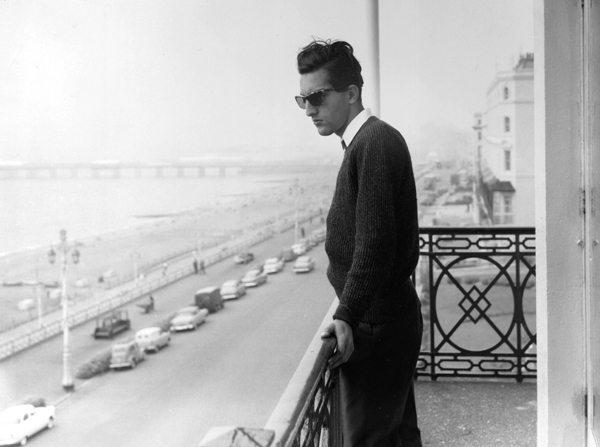 Tiger Pataudi stands in the balcony of a hotel