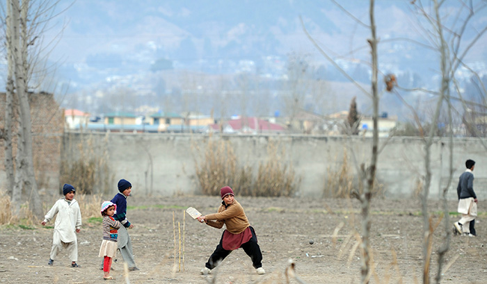 Kid Playing Cricket