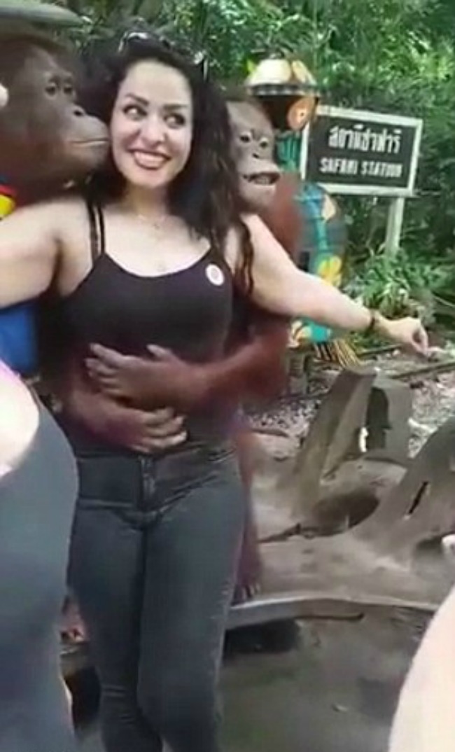 Orangutan grabs woman