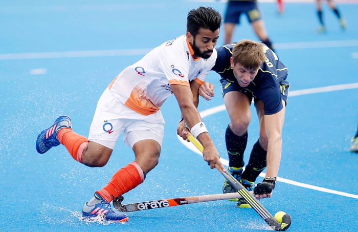 Manpreet Singh vying for the ball