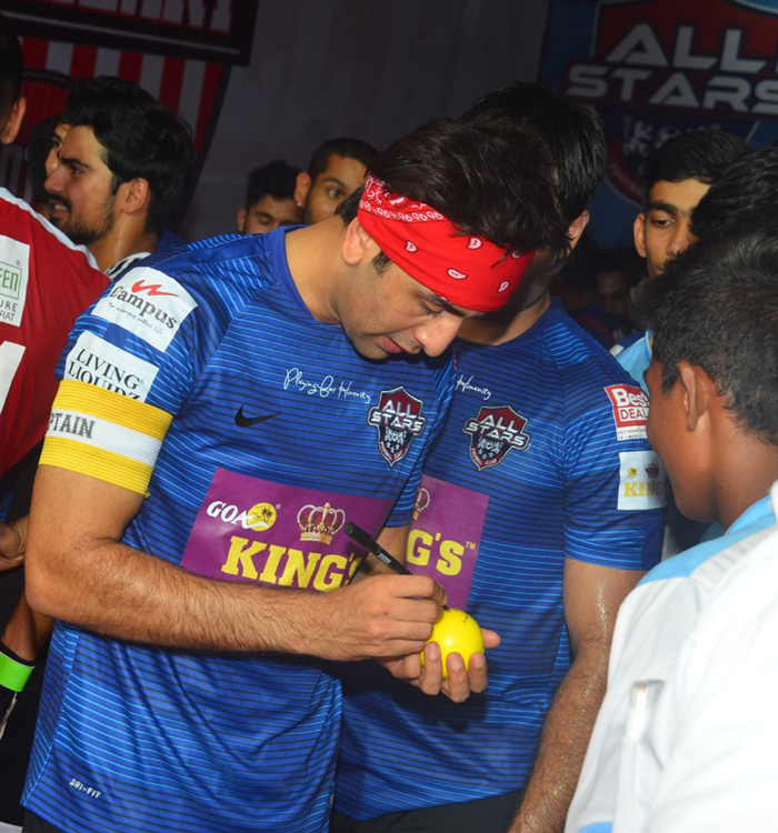 Ranbir signing an autograph