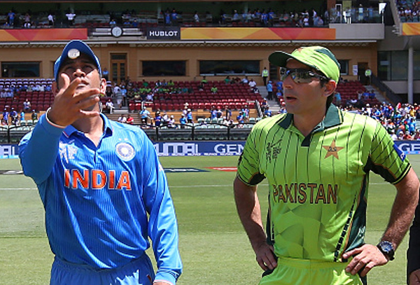 Dhoni spins the coin for the toss against Pakistan