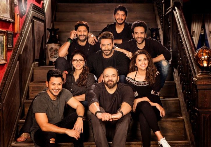A still of Golmaal Again cast with director Rohit Shetty
