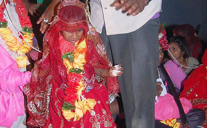 sarpanch of a village has suspended from his post because he tried to marry a minor girl