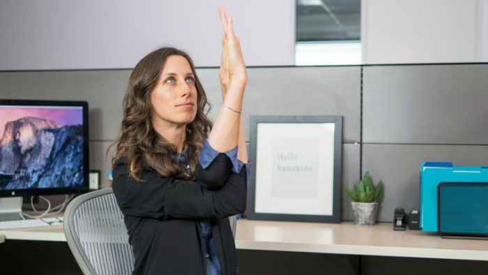 Christina Robohm a yoga instructor from Oakland California has created a mini-yoga series that help alleviate stiffness in your neck, arms, shoulders, back and your wrist in a 6-minute routine that can be performed right at your workstation